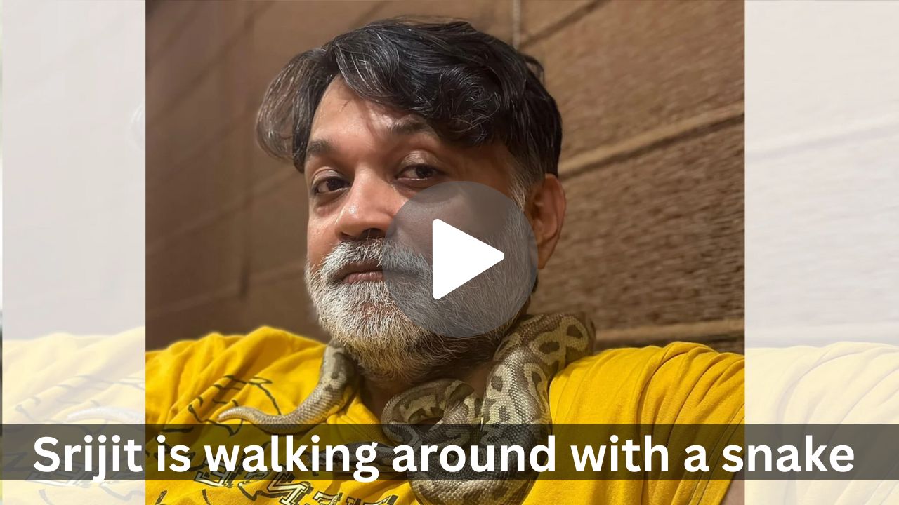 Srijit is walking around with a snake around his neck
